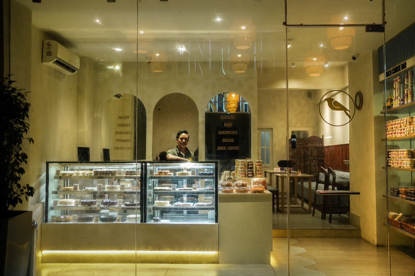 Warm Finch Cafe N Cakes counter with display cases